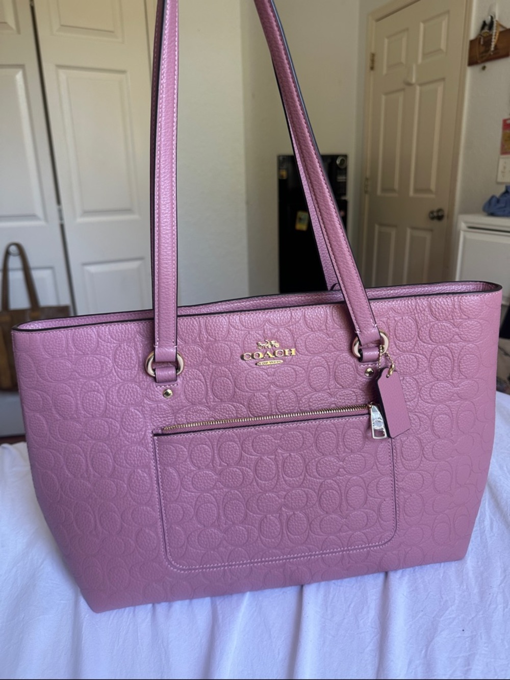 Coach dark rose Pink/ burgundy  Embossed Signature Tote with Gold Tone Hardware